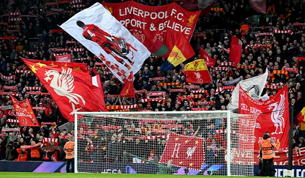 Flags from the crowd behind the goal at the Kop End in Anfield Stadium